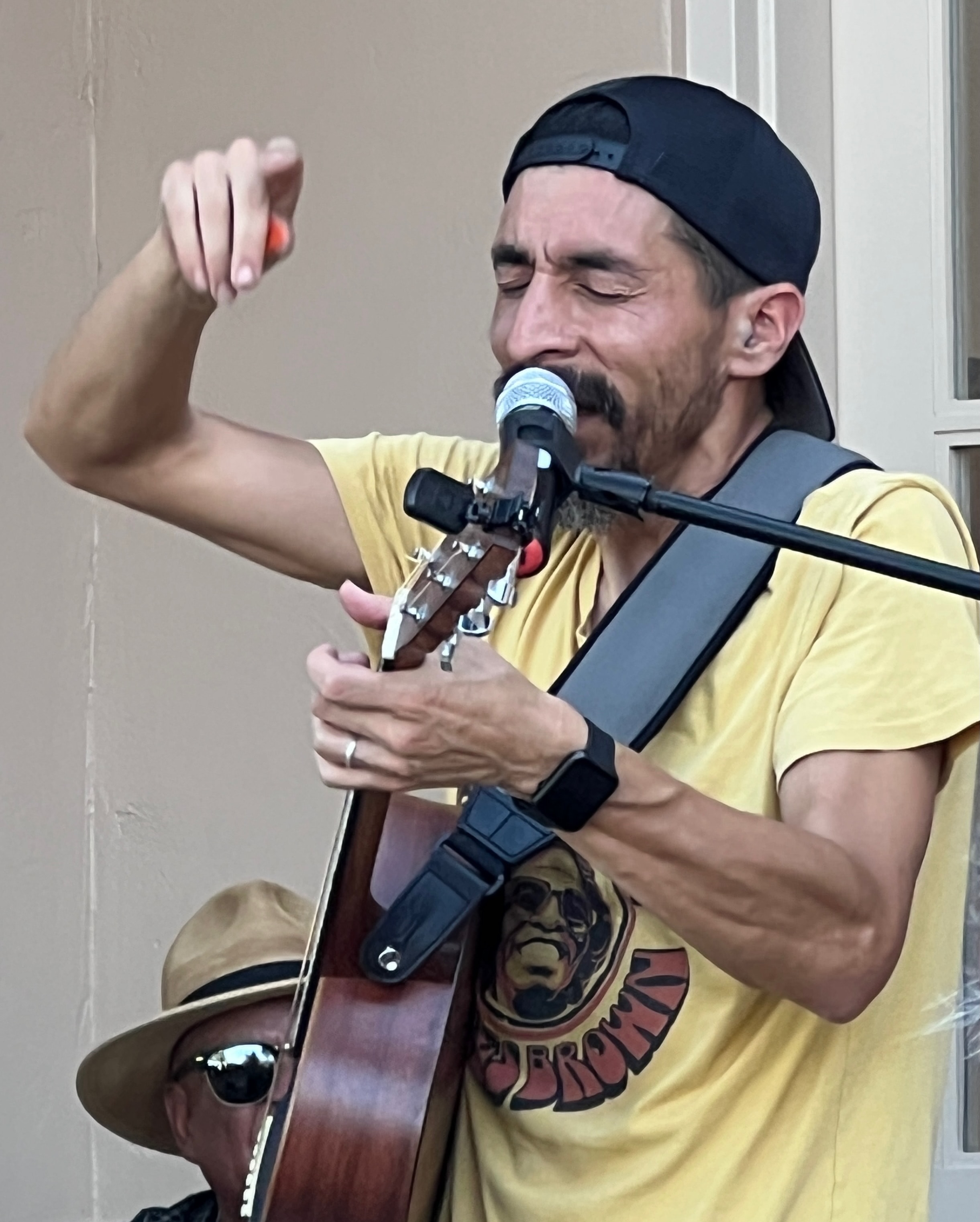 Guitarist performing outdoors at Play Music on the Porch Day