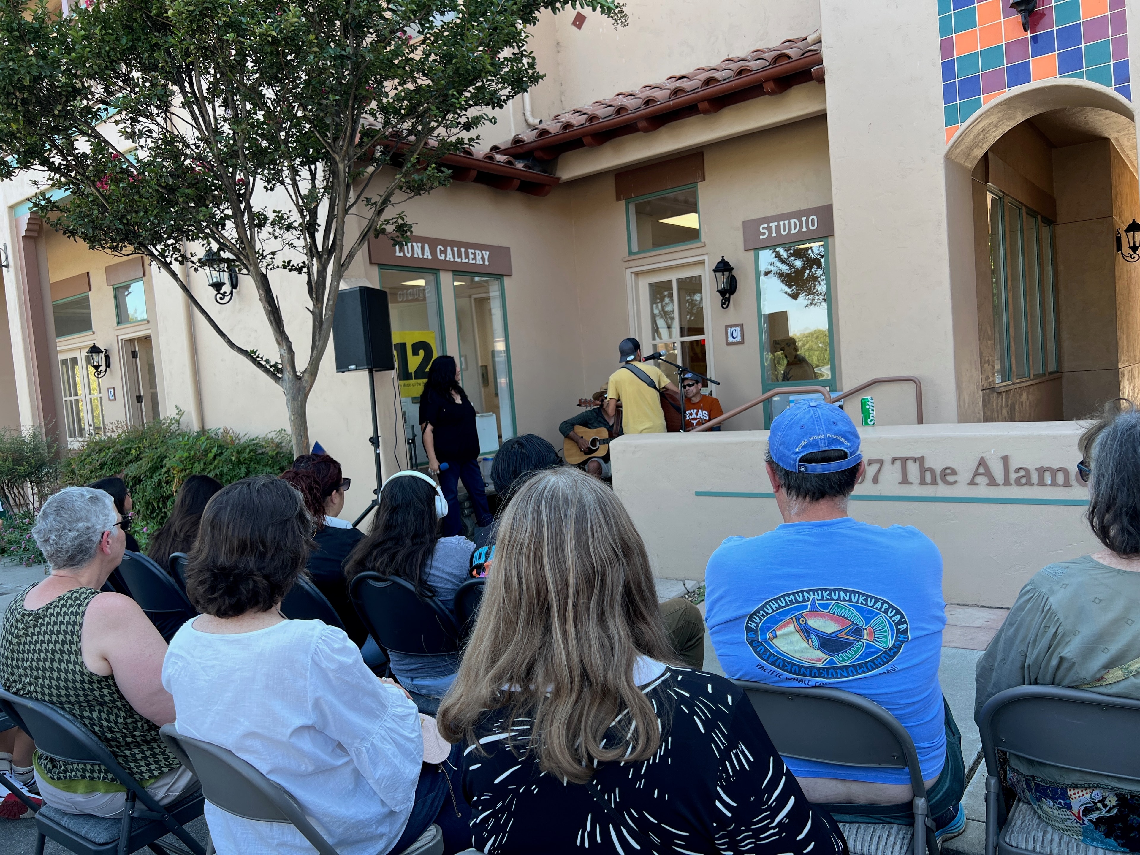 Performer on porch stage at Play Music on the Porch Day SJB